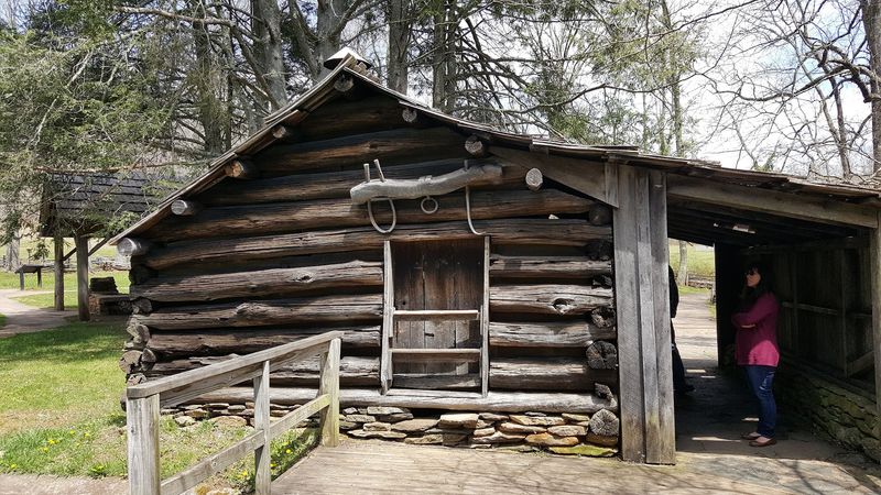 A Log Cabin With A Loom Still Inside