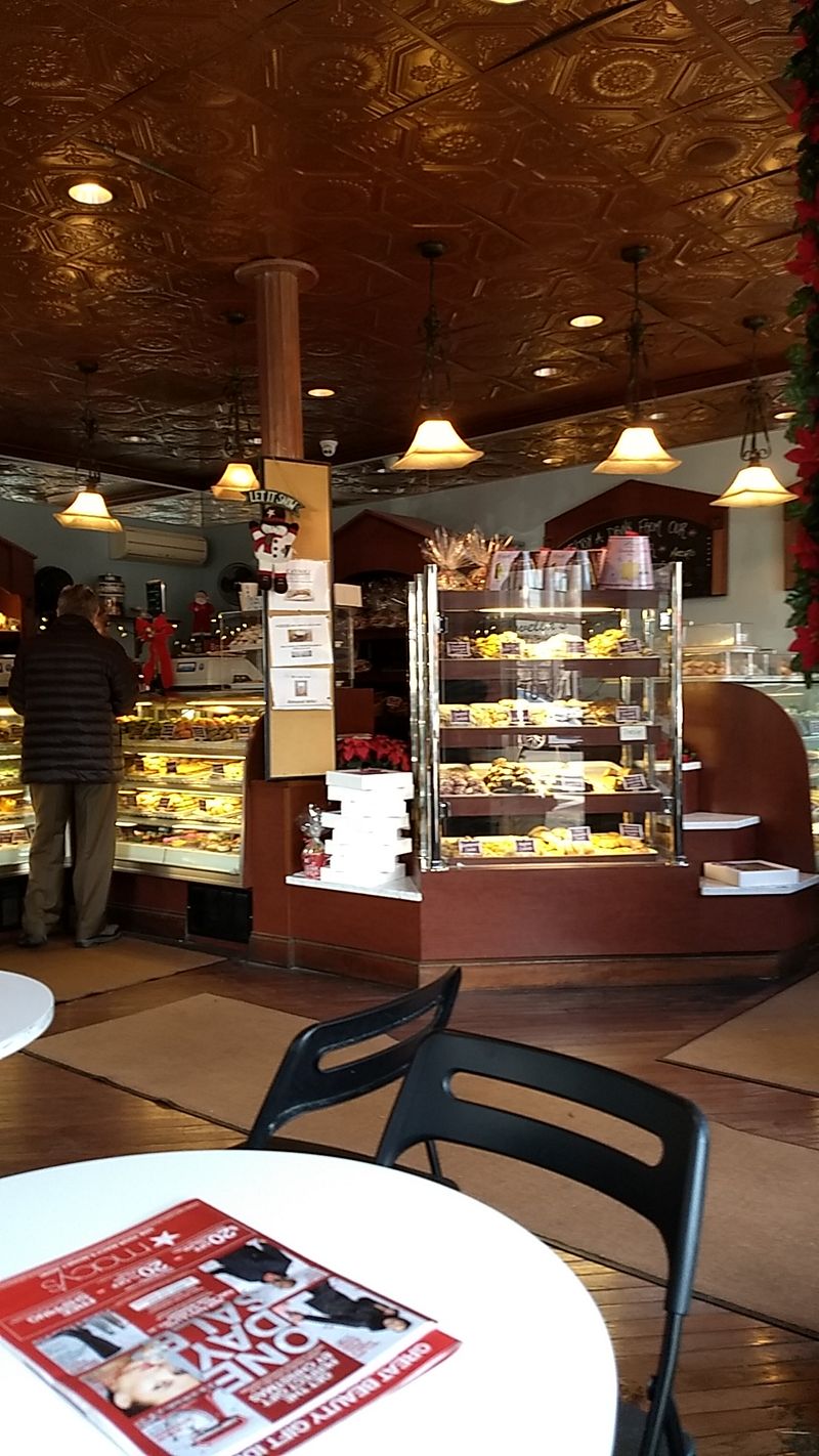 A Sweet-Smelling Shop With Seats Inside And Out