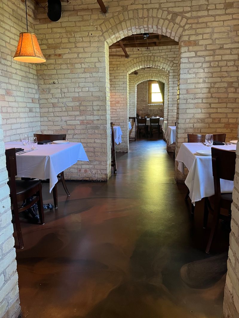 Brick, Arches, And A Root Cellar Turned Dining Room
