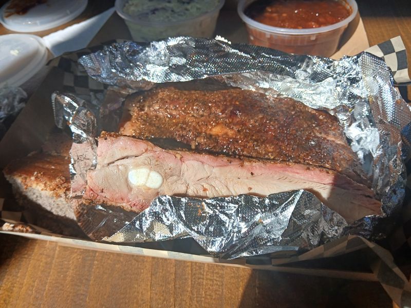 Brisket, Links, And A Sauce Served On The Side Brisket, Links, And A Sauce Served On The Side