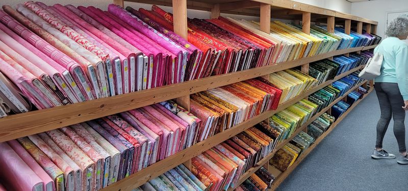 Shelves Sorted Like A Rainbow With A Plan
