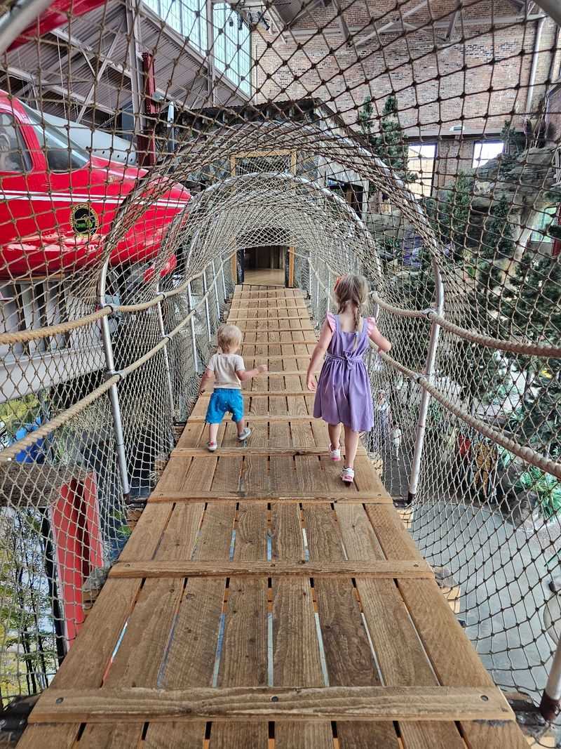 Walking A Suspension Bridge Through The Treetops