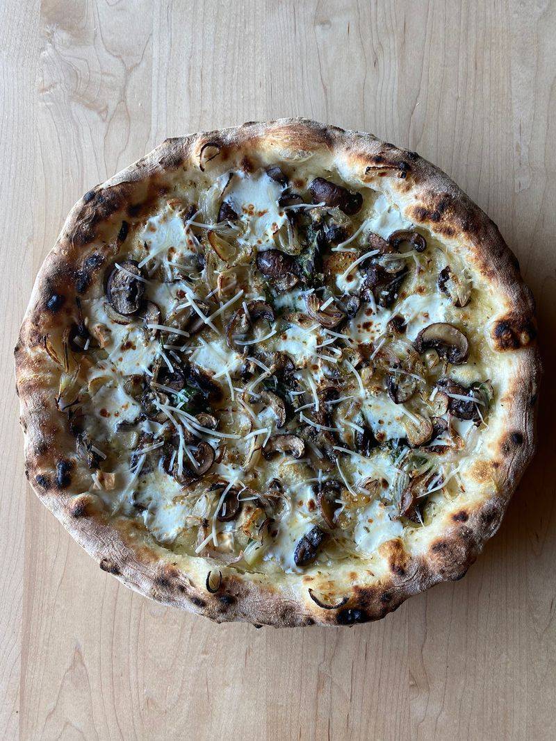 Wood-Fired Pizza Built On Patient, Naturally Leavened Dough Wood-Fired Pizza Built On Patient, Naturally Leavened Dough